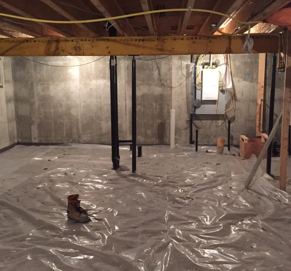 Support posts and vapor barrier installed beneath a home in Fort Mill, SC