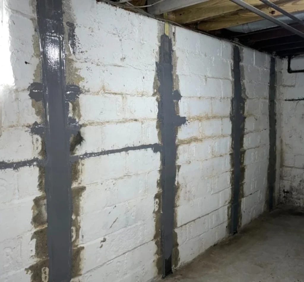 Reinforcement strips installed on a cracked basement block wall in Fort Mill, SC