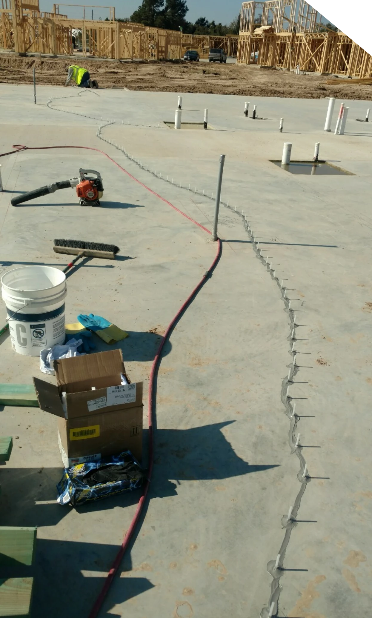 Cracked commercial concrete slab at a construction site being prepared for repair in Fort Mill, SC.