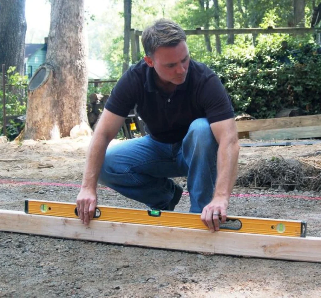 Technician checking ground level before concrete work in Fort Mill, SC