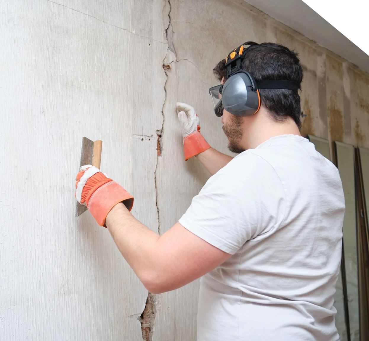Technician inspecting a cracked basement wall in Fort Mill, SC