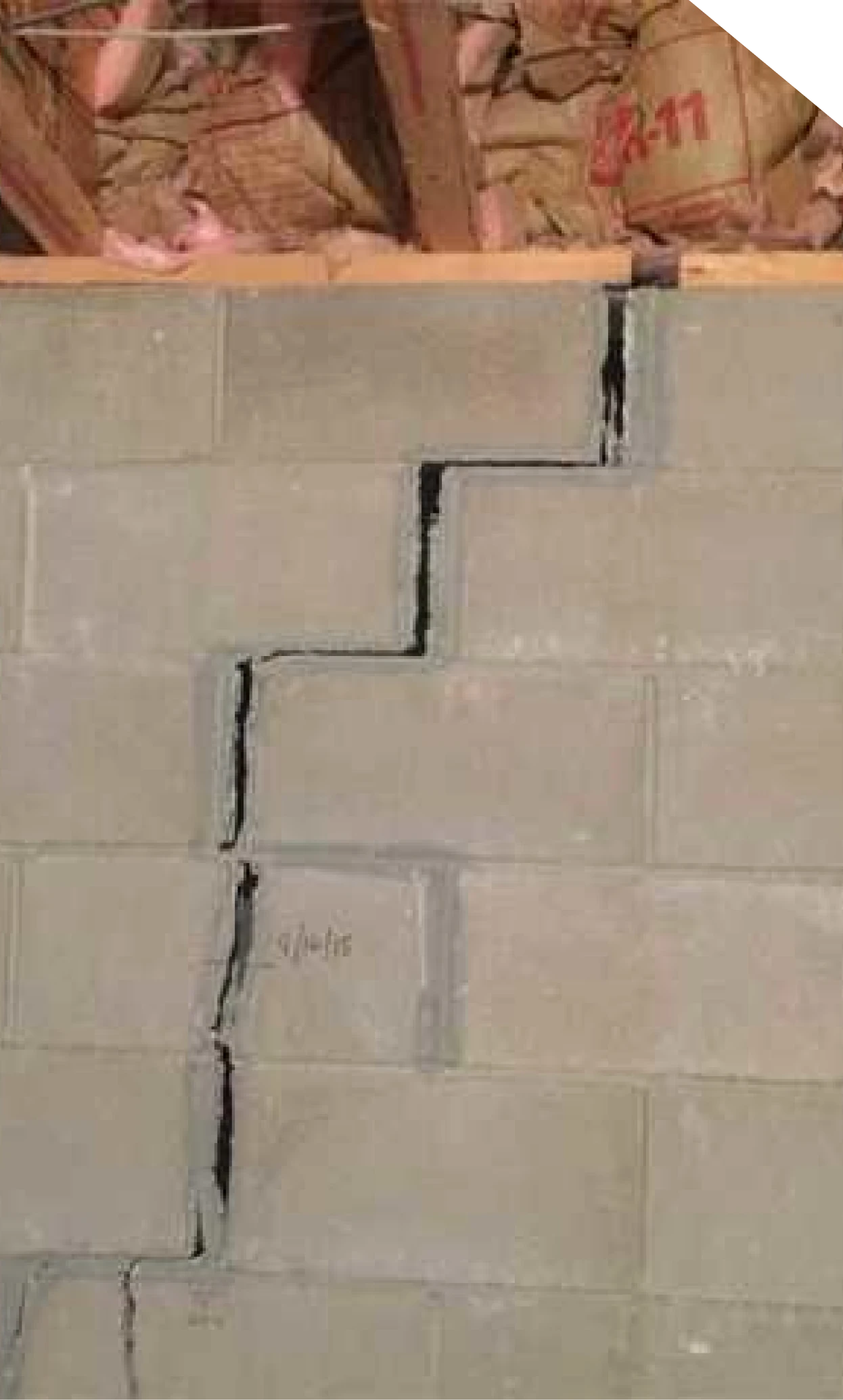 Stair-step crack in a crawl space block foundation wall in Fort Mill, NC