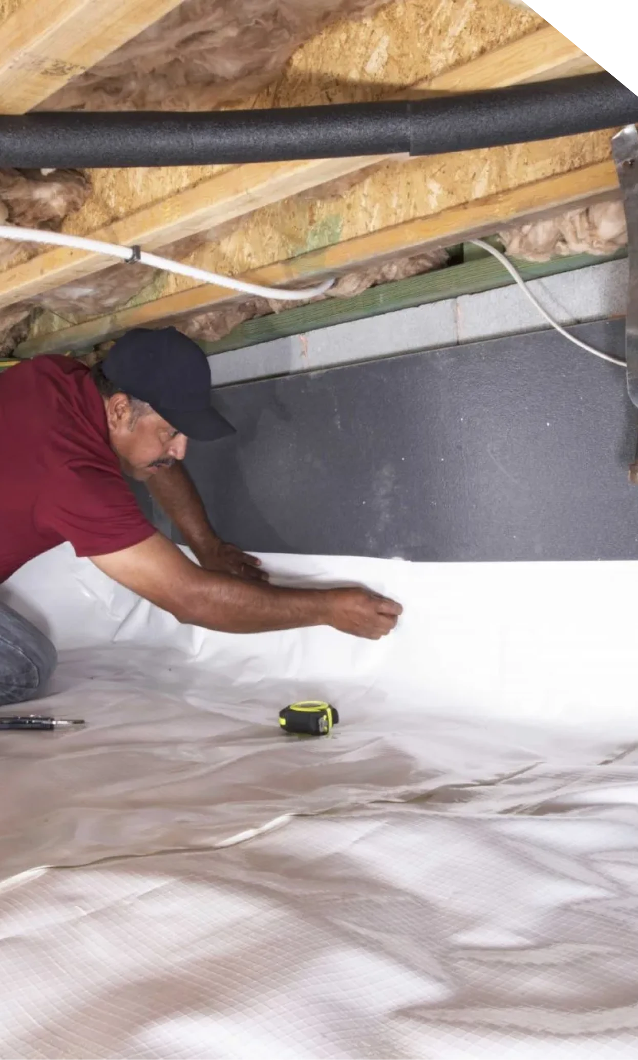 Technician installing a crawl space vapor barrier in Fort Mill, SC