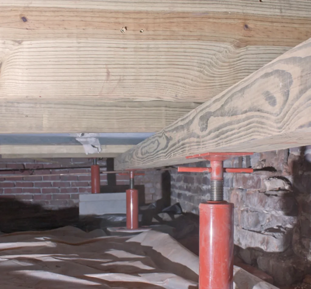Damaged floor joists being repaired beneath a home in Fort Mill, SC