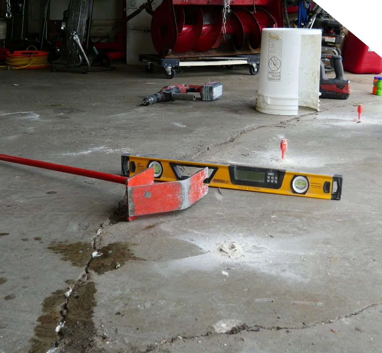 racked garage concrete slab prepared for repair and leveling in Fort Mill, SC