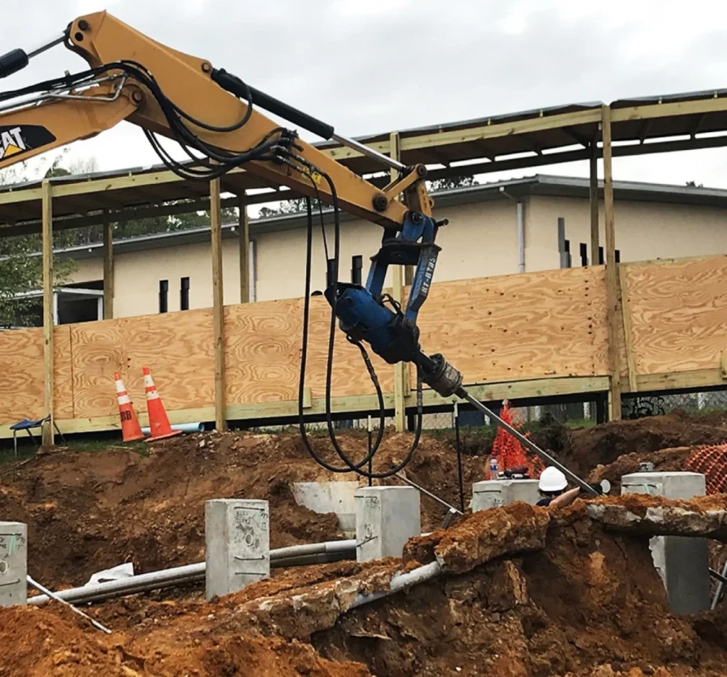 Helical tiebacks installed to stabilize a leaning retaining wall in Fort Mill, SC