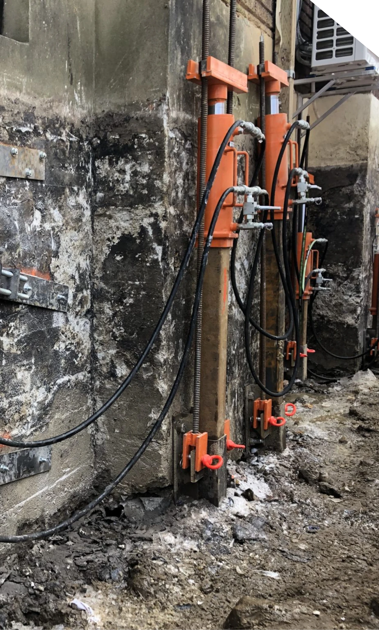 Hydraulic push piers stabilizing a foundation wall in Fort Mill, SC