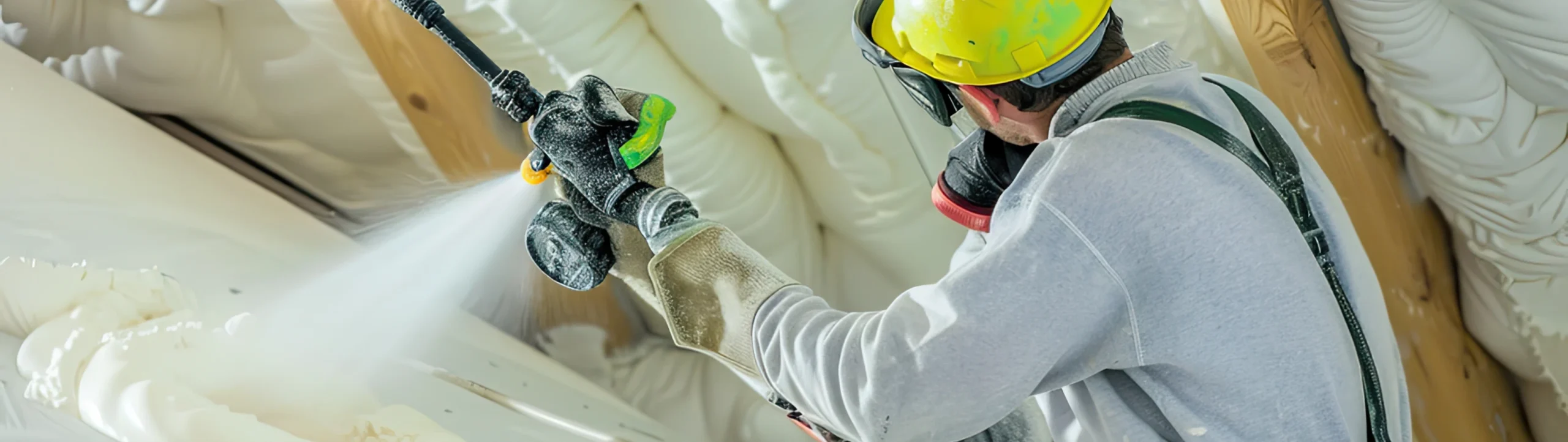 Technician applying polyurethane foam with spray equipment in Fort Mill, SC