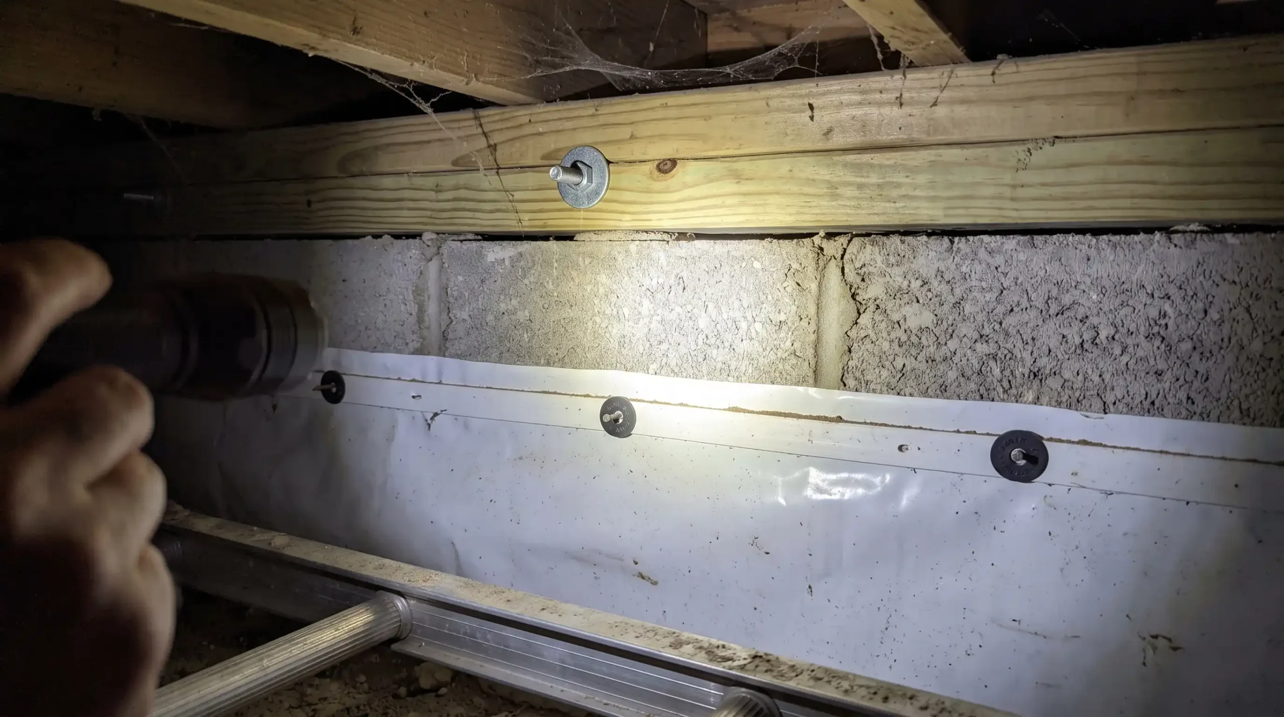 Detailed close-up view showing the mandatory three-inch bare masonry termite inspection gap